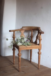 rustic antique chair and a wild flower bouquet