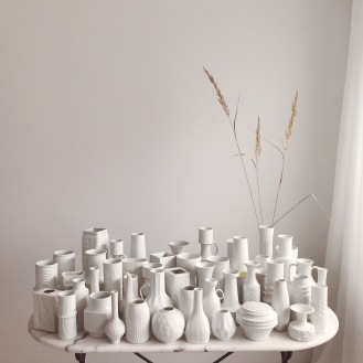 white vintage vases on marble table