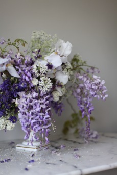 spring flower arrangement with wisteria, iris and roses / stylist Anastasia Benko