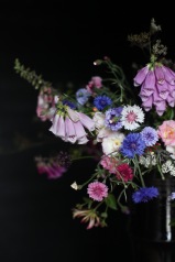moody wild flower arrangement with bachelor buttons, foxgloves, wild carrot, wild roses