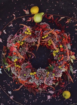colorful fall wreath with red berries and sedum